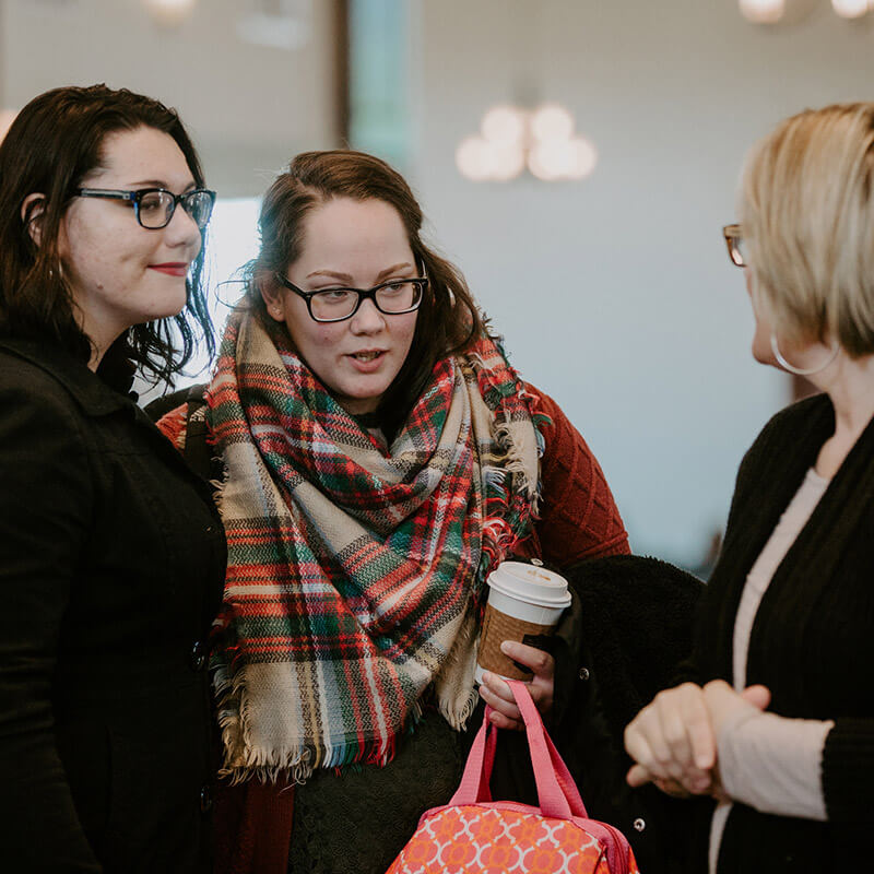 three ladies talking