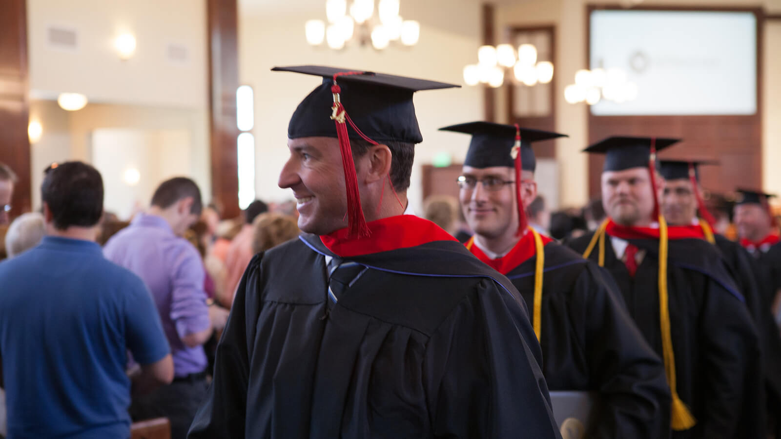 image of graduates walking together in a line