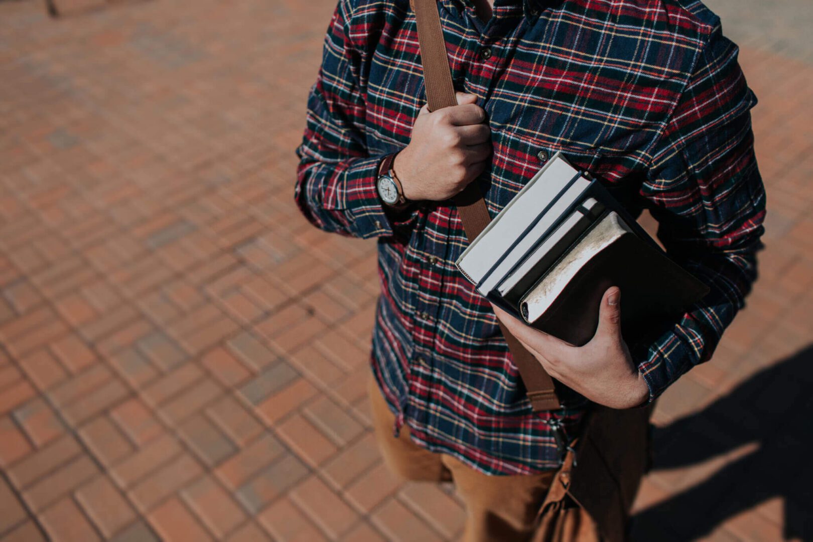 A student holding books