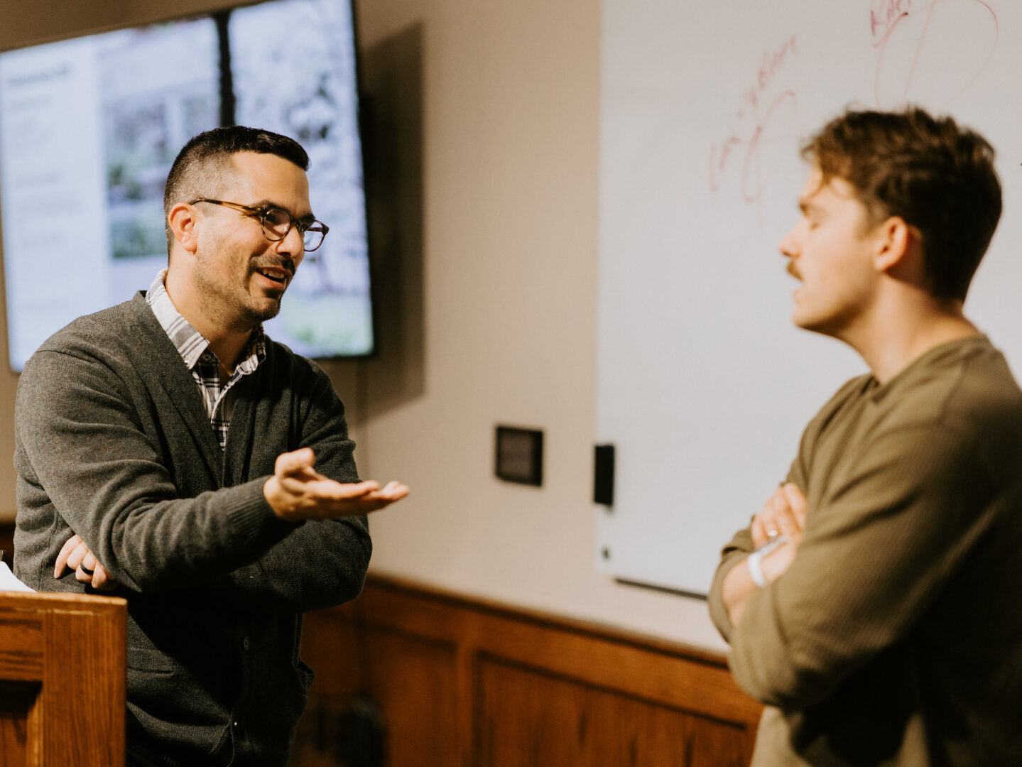 Dr. Ronni Kurtz discusses theology with a student after class.